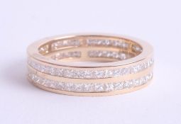 A fine near new eternity ring, 18ct yellow gold and diamond, 'Holly', assessed at 2.00 carats,