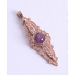 Antique rose gold purple stone set pendant, centre stone approx. 8mm, approx. 4.5g.