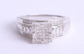 A 9ct diamond set square dress ring, size S.