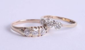 A 9ct gold trilogy ring, together with an 18ct gold gypsy ring set with old cut diamonds (2).