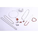 A collection of modern silver and amber set contemporary jewellery, including bangles, necklace,