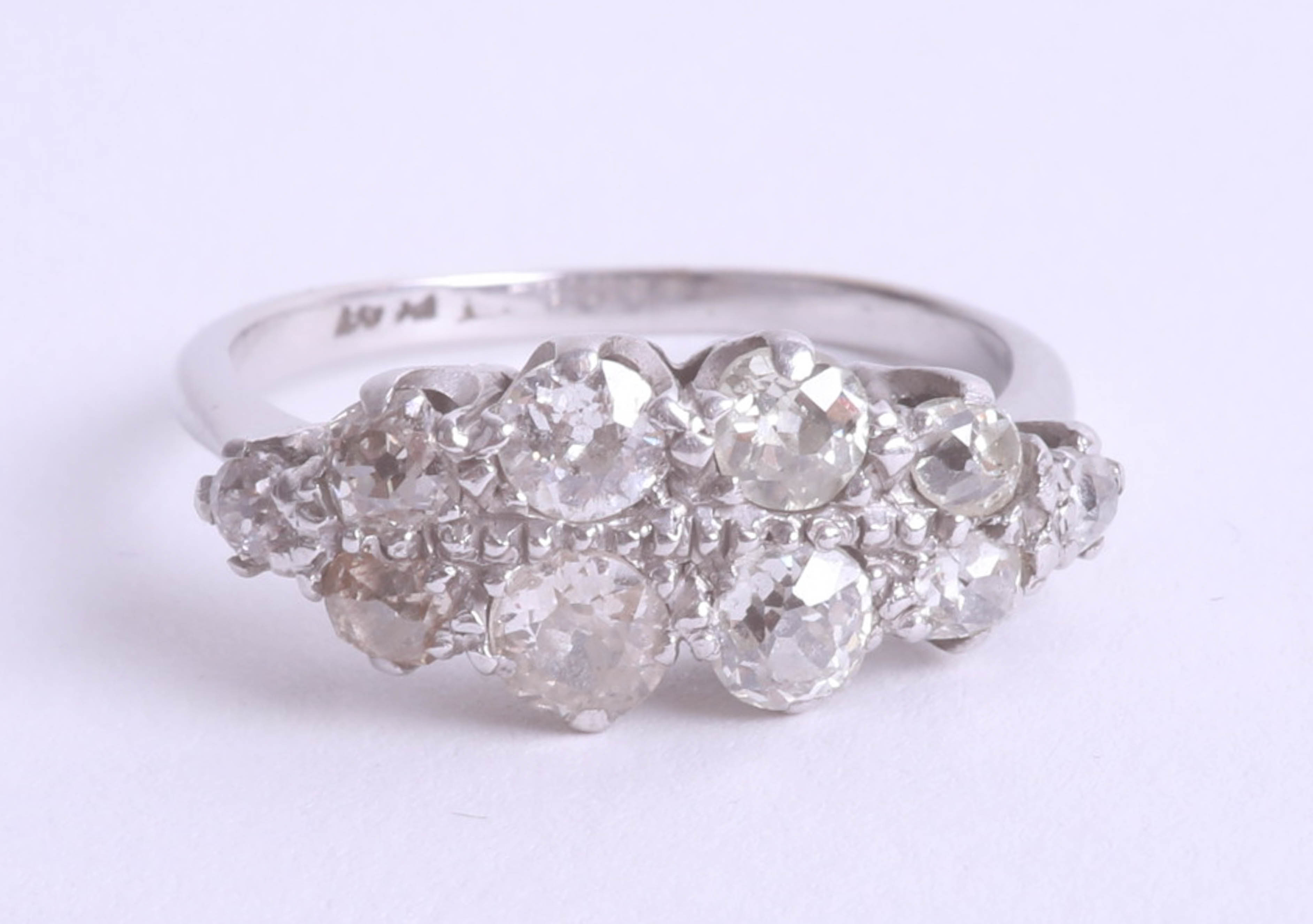 A platinum and diamond set double row ring, size S.