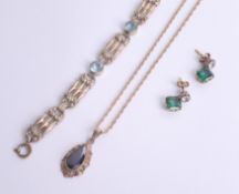 A 9ct pendant necklace, a pair of costume green stone earrings and a bracelet.