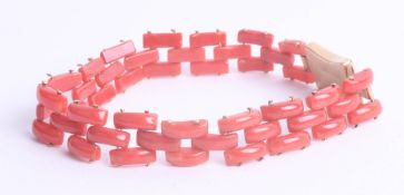 A coral gate bracelet set with a 18ct yellow gold clasp, 13.5g.