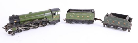 A tinplate and clockwork model railway, a Flying Scotsman and two LNER tenders.