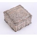 A silver continental square box with embossed decoration of figures, cattle and scroll work, 5cm x