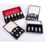 Two silver spoon sets, cased, together with a six piece miniature goblet set, the case marked The