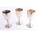 Three silver trophies, each marked 'Minehead Auction Christmas Fat Stock, 1929, 1930', height