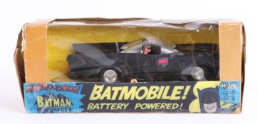 Spot-on, Magicar battery powered Batmobile with Batman and Robin figures.