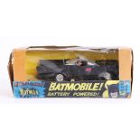Spot-on, Magicar battery powered Batmobile with Batman and Robin figures.