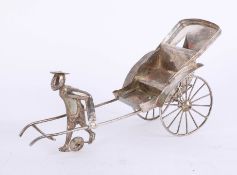 A Chinese silver model of a figure with carriage, length 24cm, approx 166.8g.