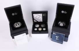 Three cased sets, including the Royal Mint 1917 War set, ten Pound silver coin, 156.29g, also