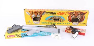 A Summit Mark One Shooting Gallery set, Merit Bazooka game and Fire Cat replica pistol, all boxed (