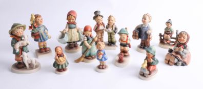 A collection of twelve Hummel figures including 'Boots', 'Sensitive Hunter', 'Little Sweeper', '