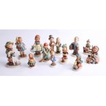 A collection of twelve Hummel figures including 'Boots', 'Sensitive Hunter', 'Little Sweeper', '