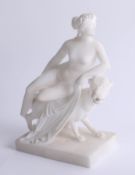 An alabaster figure of Lady sitting on Hound, height 22cm.