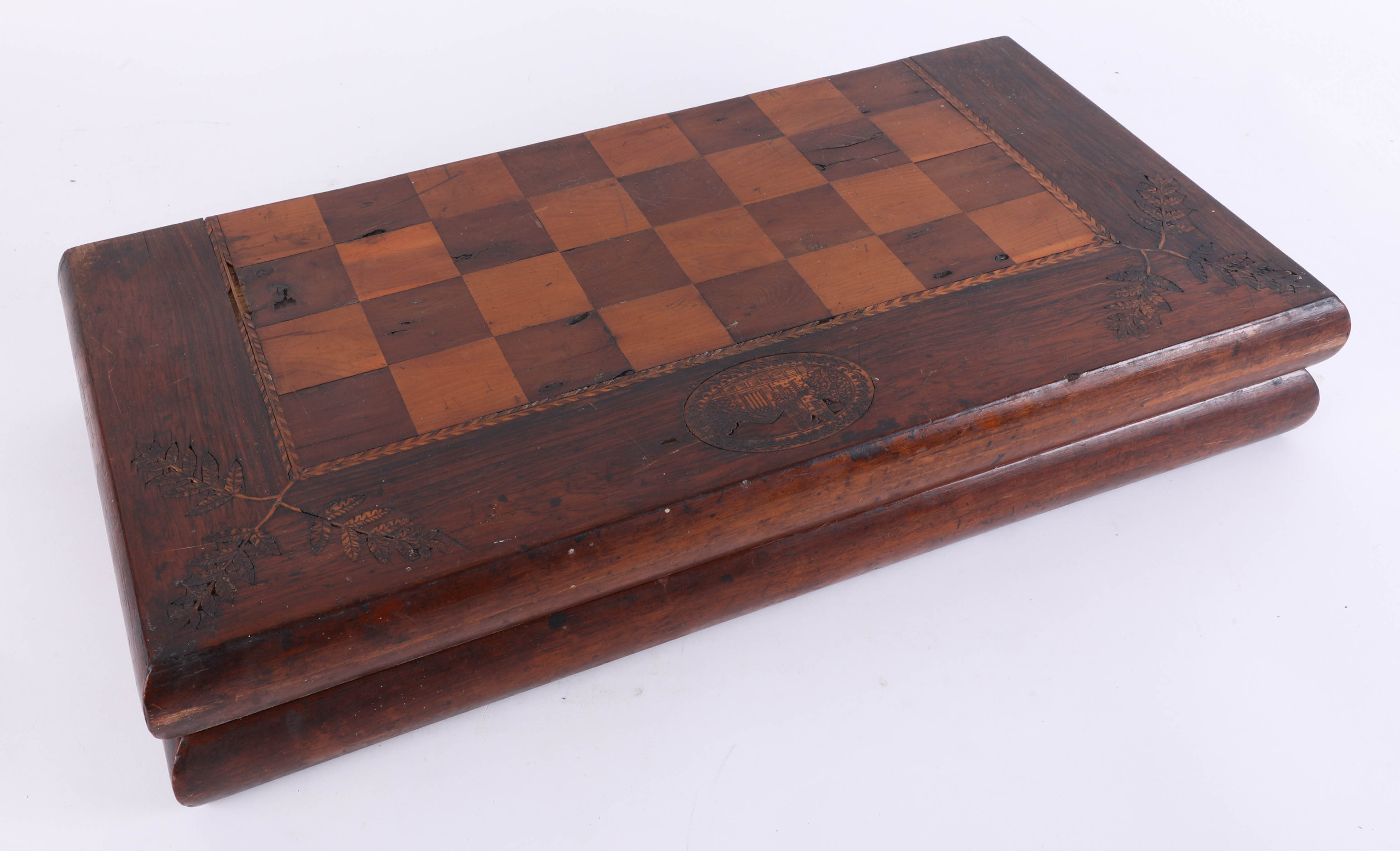 An antique, possibly Irish Killarney ware yew and other woods folding chess/backgammon board, inlaid