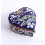 An early 20th century French enamel heart shaped box, decorated with a long red tongued lizard, a