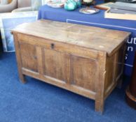 An antique English oak panelled coffer, length 115cm.