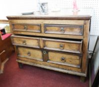 A antique 17th/18th century oak chest of drawers fitted with two long and two short doors, width