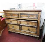 A antique 17th/18th century oak chest of drawers fitted with two long and two short doors, width