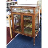 An Edwardian mahogany display cabinet with vitrine top, width 77cm.