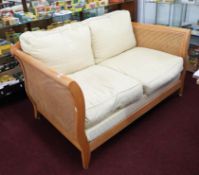 Bergere, a modern light wood, three piece lounge suite, with double cane sides and back.