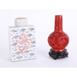 An oriental porcelain tea caddy, height 16cm, together with a reproduction cinnabar vase (2).