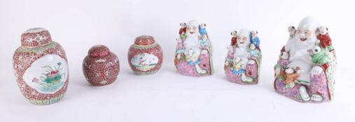 Three Chinese porcelain 'Five Boys' Buddha's, the tallest 22cm (reproduction) together with three
