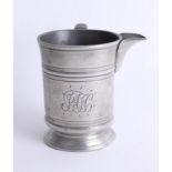 A 19th century pewter pouring tankard inscribed to the base 'Earl Russel, Croydon', height 12cm.