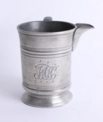 A 19th century pewter pouring tankard inscribed to the base 'Earl Russel, Croydon', height 12cm.