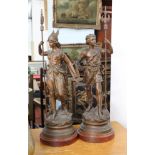 A pair of spelter figures 'Sagesse' and 'Courage' on wooden plinths, height 63cm (2).