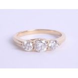 An 18ct diamond trilogy ring approx. 1.00ct, estimated colour and clarity D/SI1, Size M.