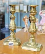 A pair of brass candlesticks, height 25cm.