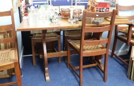 Heals, an oak refectory dining table and six bar back chairs with woven seats.