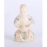 An oriental carved ivory seated figure, height 7cm.