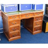 A mahogany pedestal desk, fitted with nine drawers, with a green leather top, 122cm x 61cm.