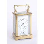 A French carriage clock with alarm, with Roman numerals, two dials, height 15cm, handle up.