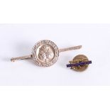 A 10K gold pin, commemorating fifty years service in the Commercial Cable Company, together with