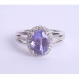 An 18ct white gold tanzanite and diamond ring, approx. 2.75ct, Size N.