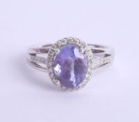 An 18ct white gold tanzanite and diamond ring, approx. 2.75ct, Size N.