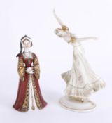 A continental porcelain figure of a lady in gilt ball gown with black headscarf, Vienna mark, height