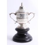 Of Plymouth and Lady Nancy Astor interest, a small silver doubled handled trophy on a pedestal base,