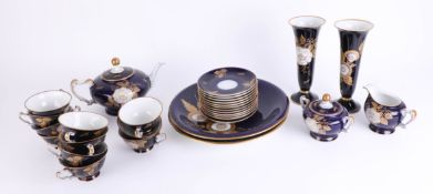 Heinrich porcelain, a tea service on blue ground with gilt and floral pattern.