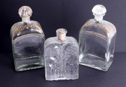 A pair of early 20th century spirit glass decanters with gilt decoration, marked Liquor Bottle,