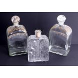 A pair of early 20th century spirit glass decanters with gilt decoration, marked Liquor Bottle,