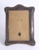 A silver photo frame, overall size 24cm x 17cm.