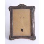 A silver photo frame, overall size 24cm x 17cm.