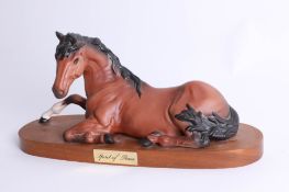 Beswick, 'A Spirit of Peace' unglazed on wood plinth, length 29cm.