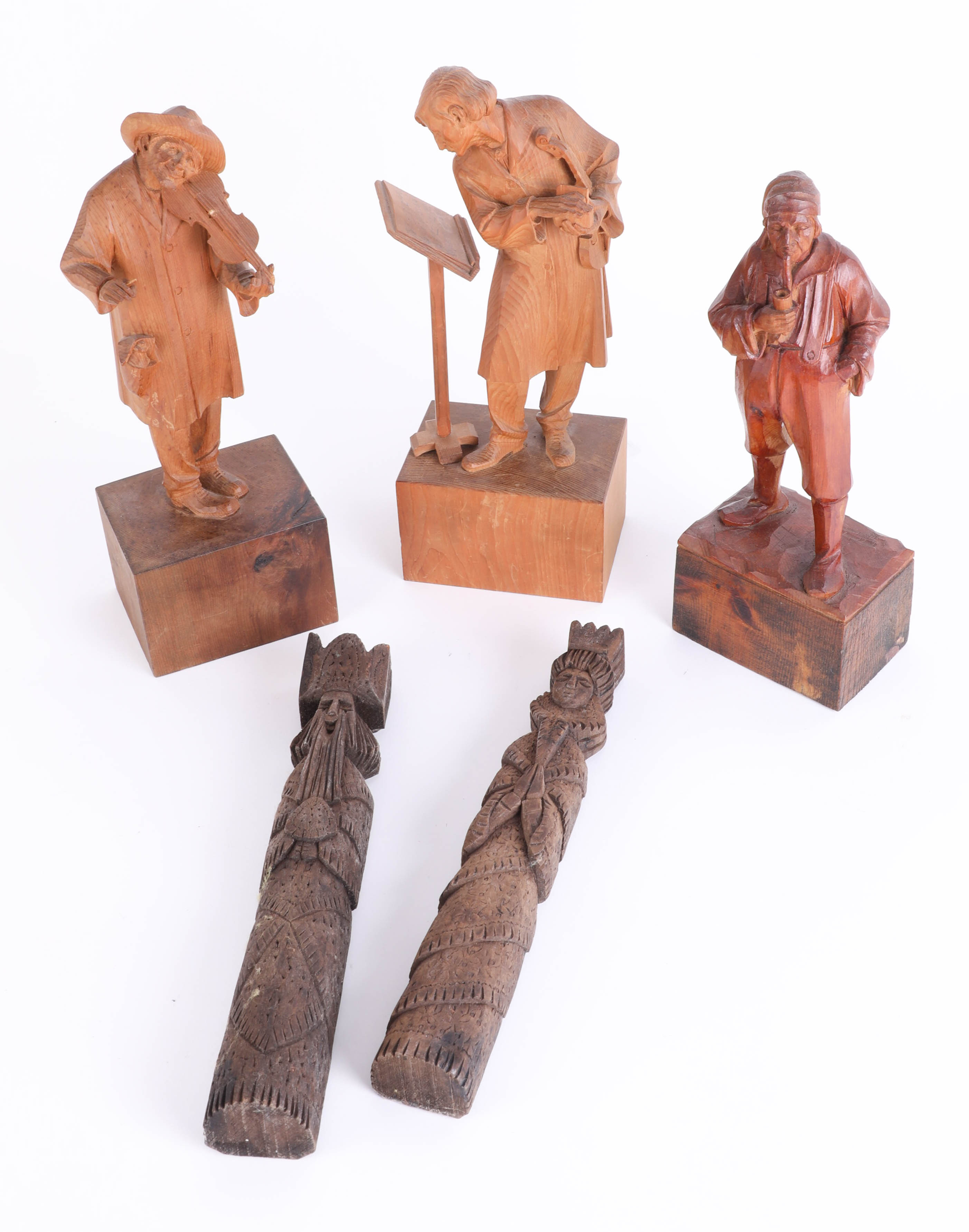 Three continental wood carvings together with a pair of carvings King and Queen (5) height 30cm.